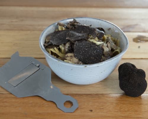 Black truffles and a truffle shaver